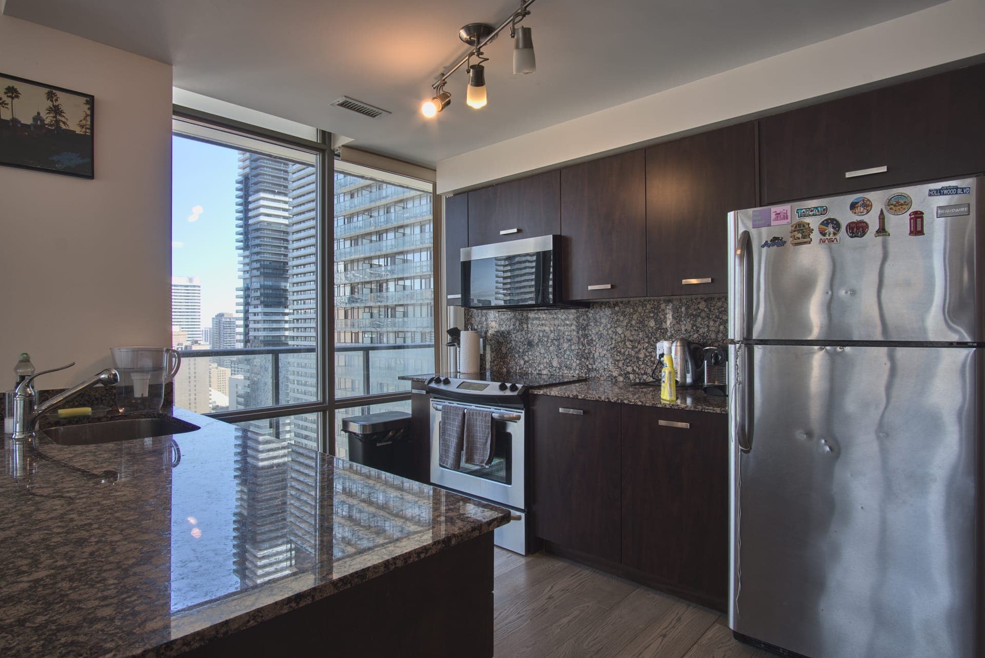 Downtown Skyline Condo — Kitchen with city views
