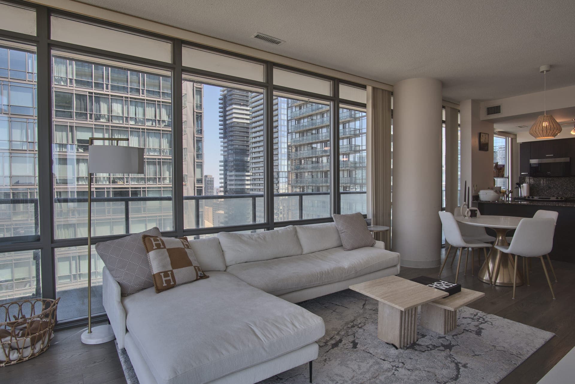 Downtown Skyline Condo — Living room with floor-to-ceiling windows
